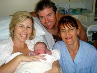 Hypnobirthing Parents with Caregiver and Newborn Baby