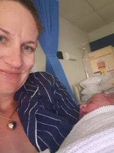 New mum Helen holding her baby