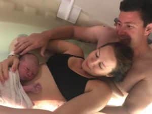 Mum, Dad and baby in the birth pool