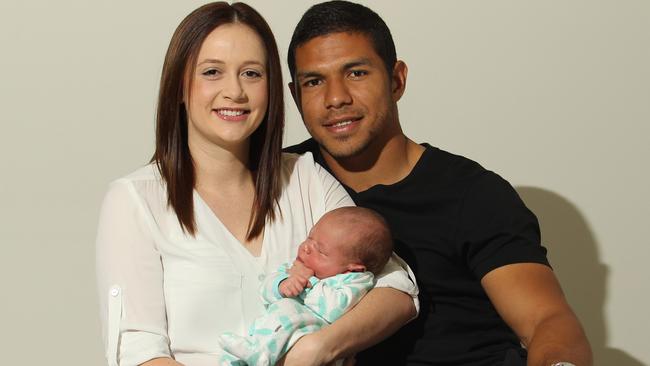 Gold Coast Titans player David Mead with his wife Taneal with their newborn son Paxton. Picture by Scott Fletcher