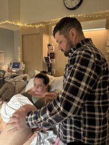 women bearing down baby