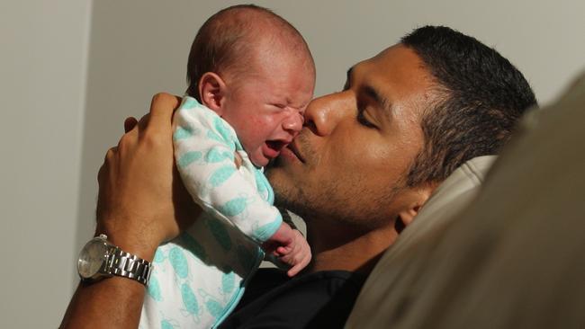 Gold Coast Titans player David Mead with his newborn son Paxton. Picture: Scott Fletcher