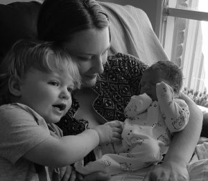 Mother and older sibling bonding with