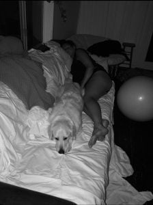 Melissa laying down breathing through her surges