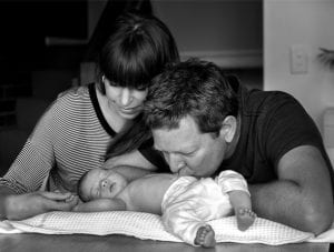 Olga, Simon kissing baby Minerva