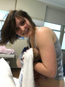 Anna Holding baby lilly only seconds after birth