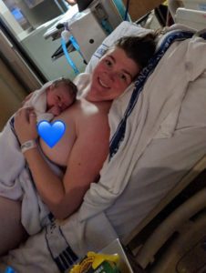 Mother holding new born baby after a natural birth