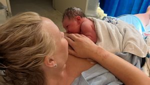 mum breastfeeding baby after birth