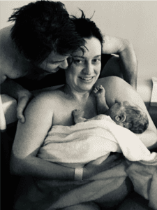 Hypnobirthing Parents Rebecca & Joel holding their newborn baby